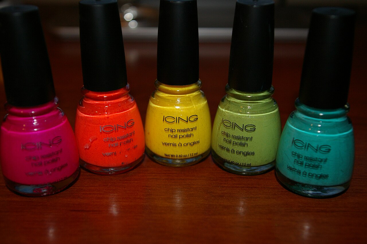 Rows of colourful nail polish bottles